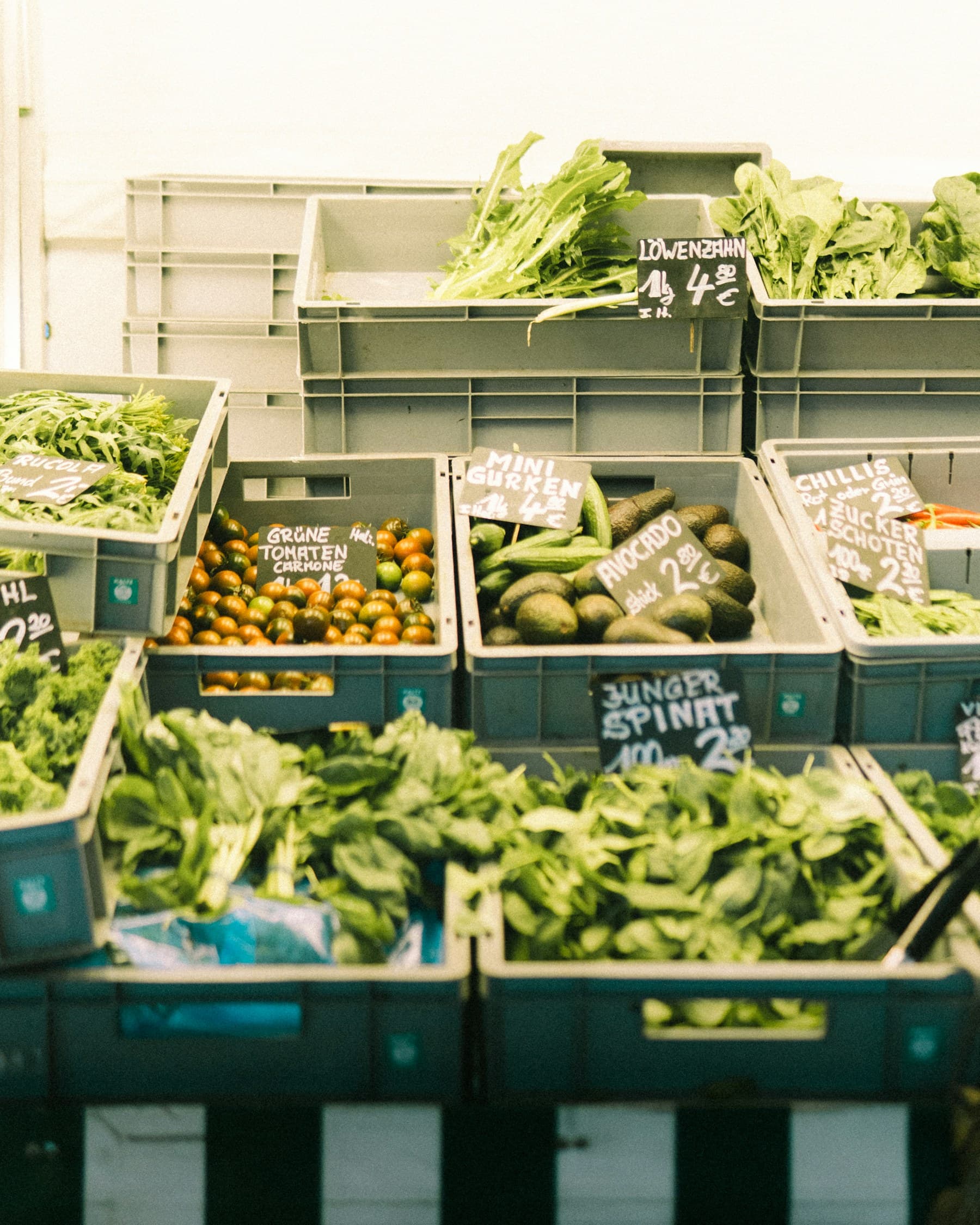 Fresh vegetables displayed in market crates